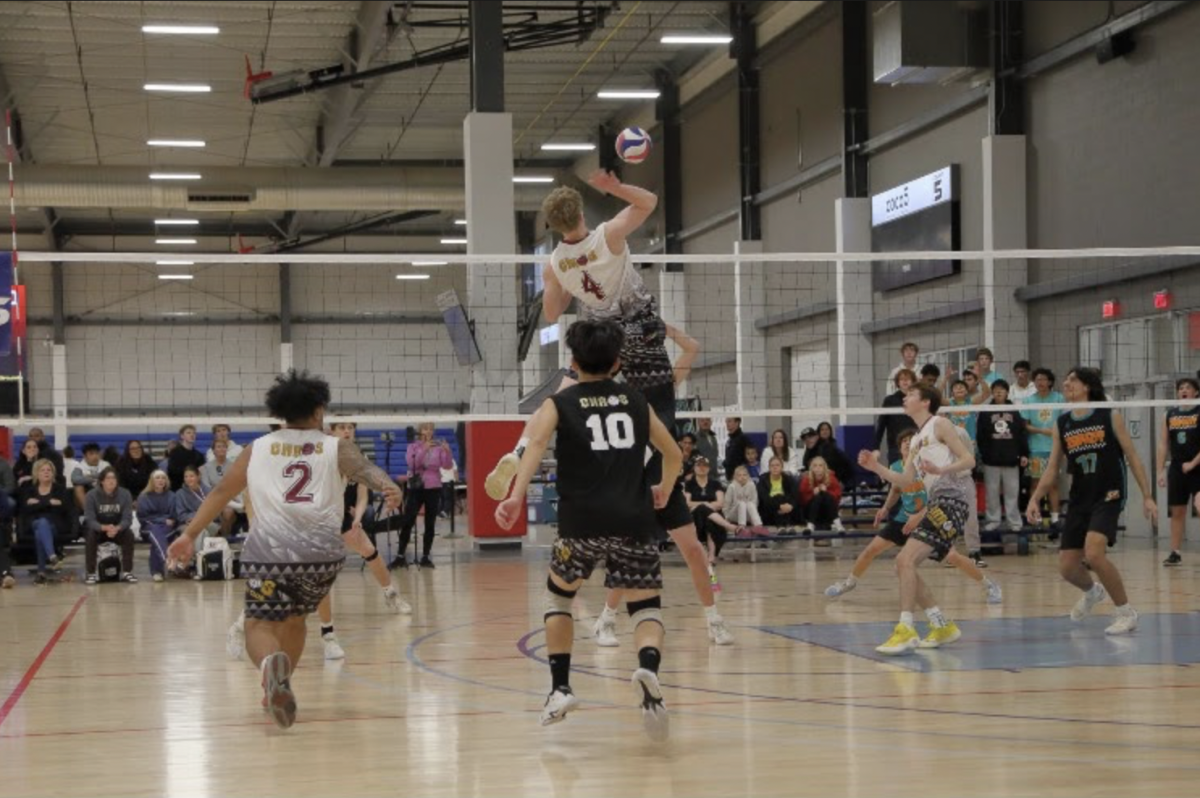  Caleb Russell (#4) goes in for a spike. (courtesy of Caleb Russell)